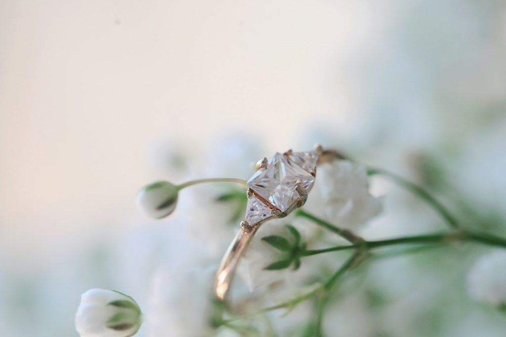 Beautiful wedding ring close up on flowers